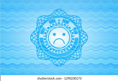 sad face icon inside light blue water style emblem.