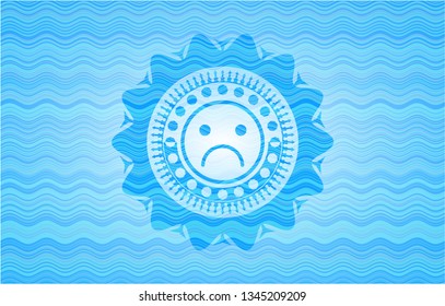 sad face icon inside light blue water wave style emblem.