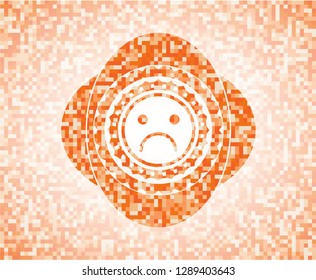 sad face icon inside orange mosaic emblem