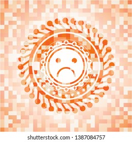 sad face icon inside orange mosaic emblem