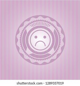 sad face icon inside pink emblem. Vintage.