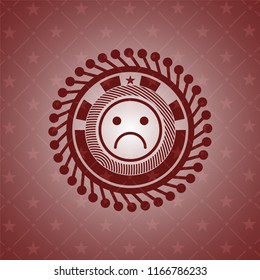 sad face icon inside realistic red emblem