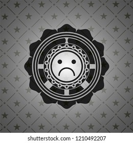 sad face icon inside realistic black emblem
