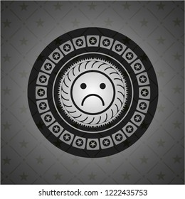 sad face icon inside realistic dark emblem