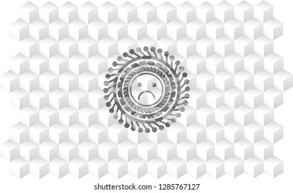sad face icon inside realistic grey emblem with geometric cube white background