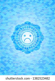 sad face icon inside realistic sky blue emblem. Mosaic background