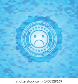 sad face icon inside realistic sky blue mosaic emblem