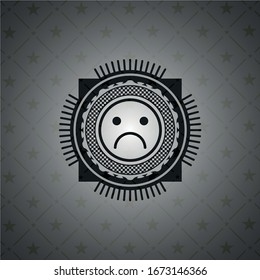 sad face icon inside realistic dark emblem