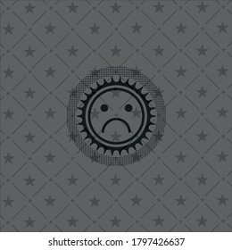 sad face icon inside realistic black emblem. 