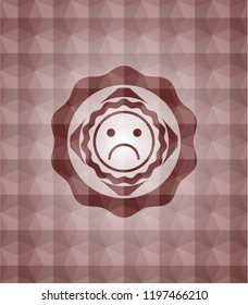 sad face icon inside red seamless badge with geometric pattern background.