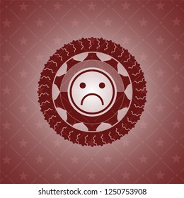 sad face icon inside red icon or emblem