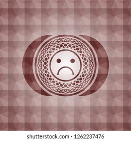 sad face icon inside red seamless geometric badge.