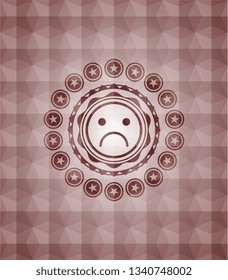 sad face icon inside red seamless badge with geometric pattern background.
