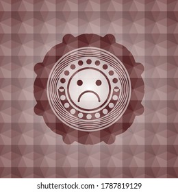 sad face icon inside red seamless polygonal badge. 