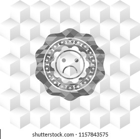 sad face icon inside retro style grey emblem with geometric cube white background