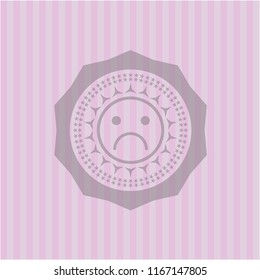 sad face icon inside retro pink emblem