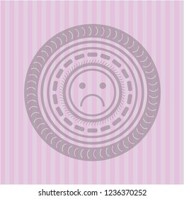 sad face icon inside retro style pink emblem