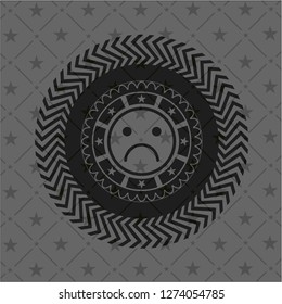 sad face icon inside retro style black emblem
