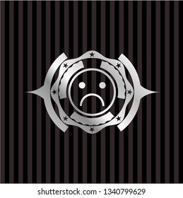 sad face icon inside silver badge or emblem