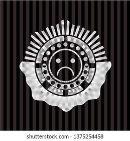 sad face icon inside silver shiny badge