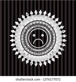 sad face icon inside silver shiny emblem