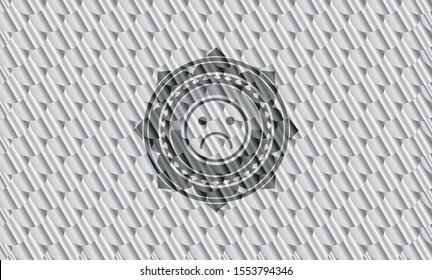 sad face icon inside silver color emblem or badge. Scales pattern. Vector Illustration. Detailed.