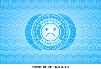 sad face icon inside sky blue water badge background.