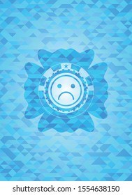 sad face icon inside sky blue emblem with mosaic background