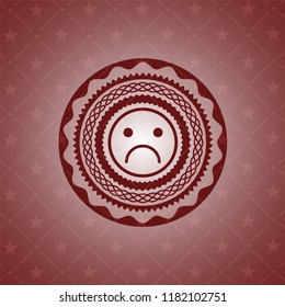sad face icon inside vintage red emblem