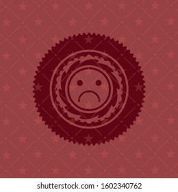sad face icon inside vintage red emblem