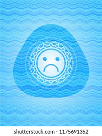 sad face icon inside water concept style emblem.