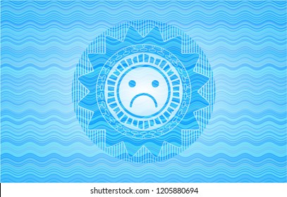 sad face icon inside water wave style badge.