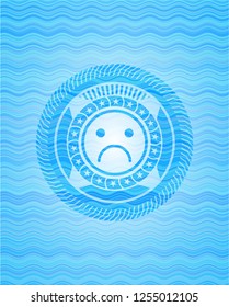 sad face icon inside water badge background.