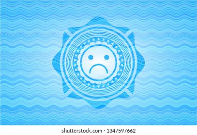 sad face icon inside water wave badge.