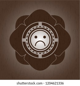 sad face icon inside wood emblem. Retro