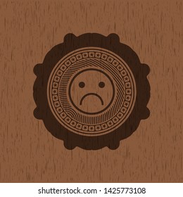 sad face icon inside wood emblem. Retro