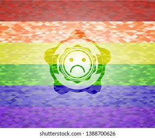 sad face icon on mosaic background with the colors of the LGBT flag
