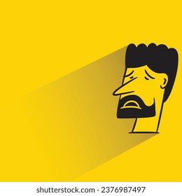 sad face with shadow on yellow background