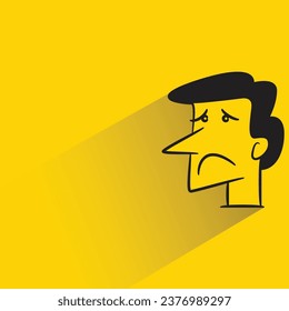 sad face with shadow on yellow background