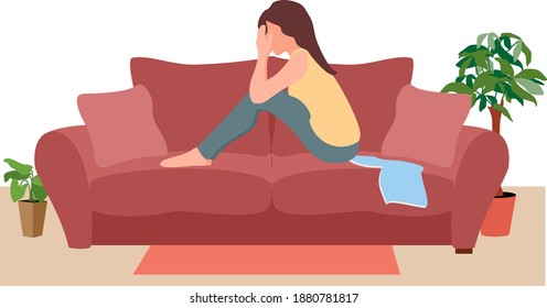 Sad girl hug knees sit on couch feels lonely. Unhappy young woman suffers sitting on couch alone.