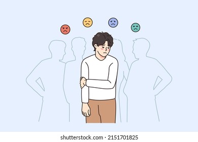 Sad guy feel lonely and uncomfortable in society. Unhappy young man suffer from solitude and loneliness in crowd, have various emotions. Frustration and depression. Vector illustration. 