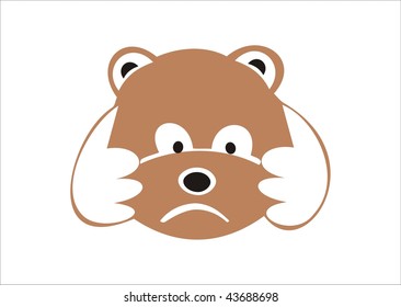 Sad little bear holding its head in its paws.