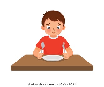 Sad little boy feel hungry looking at empty plate