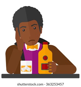 Sad man with bottle and glass.