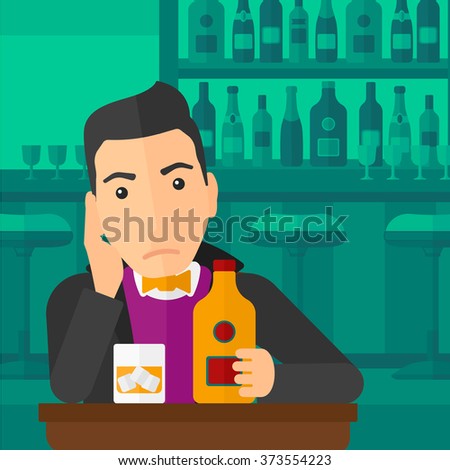 Sad man with bottle and glass.
