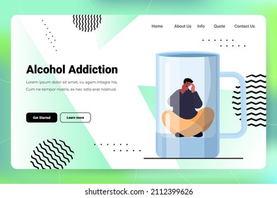 sad man drinker alcoholic sitting in empty glass depressed addicted drunk guy having problem alcohol addiction