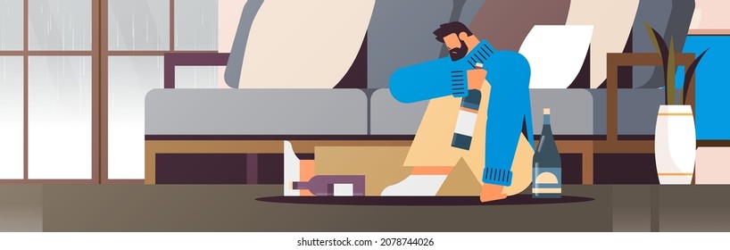 sad man drinker with bottles alcoholic drinking alone depressed addicted drunk guy having problem alcohol addiction