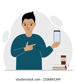 A sad man holds a mobile phone in one hand and points at it with the index finger of his other hand. Vector flat illustration