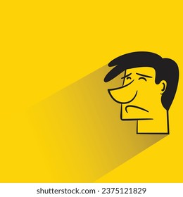 sad man with shadow on yellow background