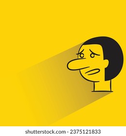 sad man with shadow on yellow background